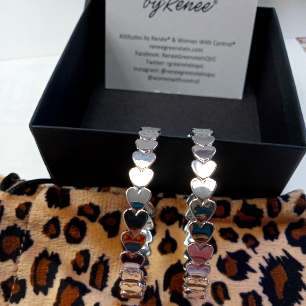 2" Silvertone hoop earings showcasing hearts.